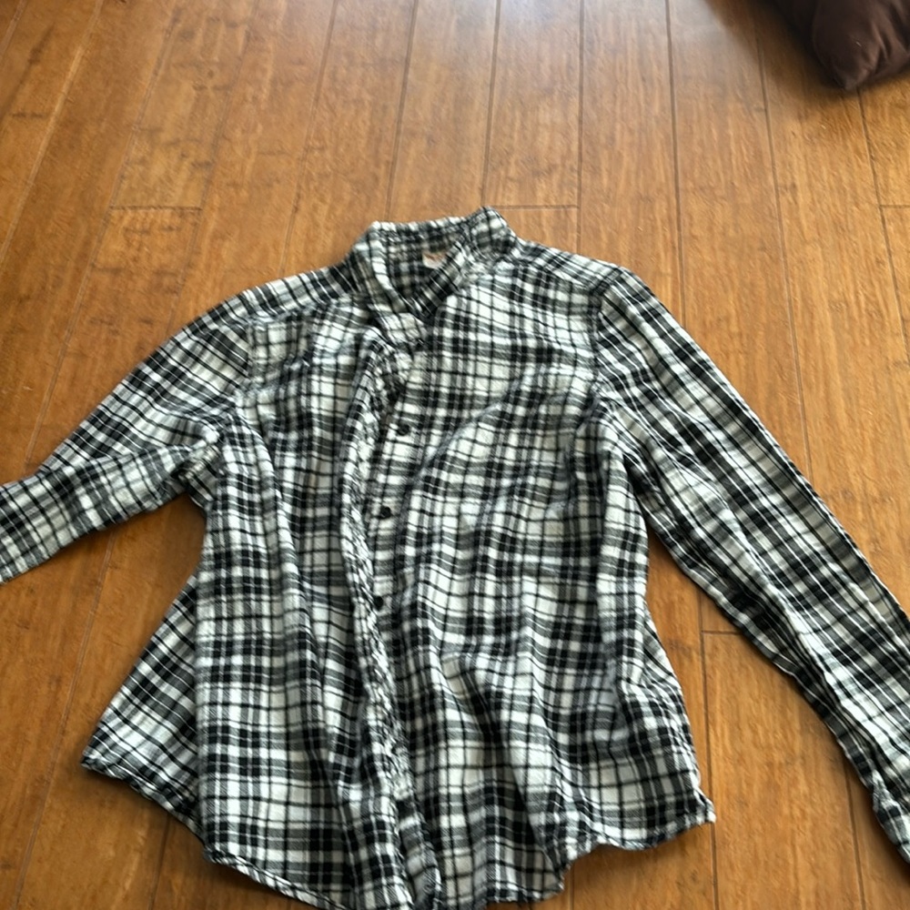 This is a 12-14 kids black plaid faded glory flannel
